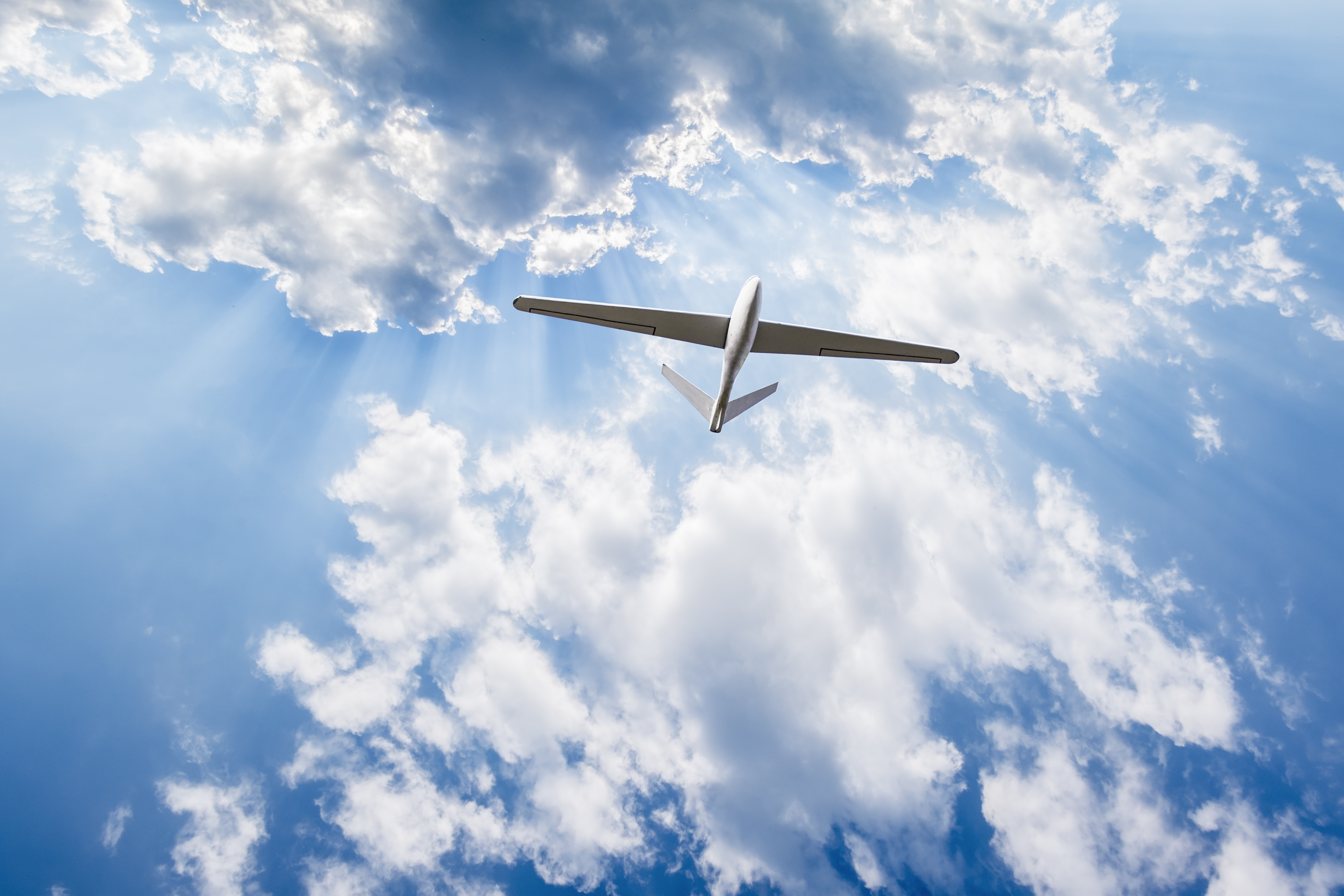 Unmanned aerial vehicle in cloudy sky Vigilant Aerospace